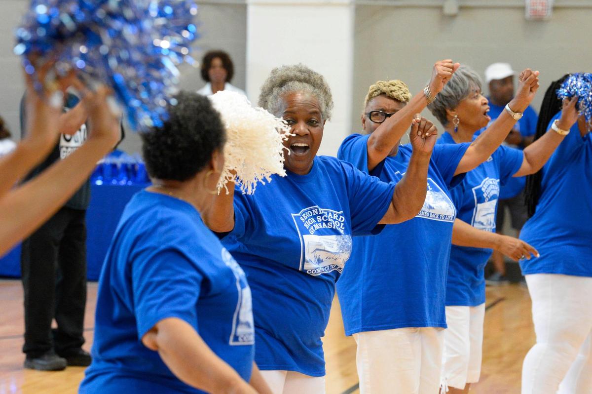 Minnie Thompson, Second Ward High School Class of 1966, center, helps to lead alumni cheerleaders during the 50th anniversary of the closing of the school at the Second Ward High School Gymnasium and Museum on Saturday, June 1, 2019. After the school closed its doors in 1969, it was bulldozed as part of urban renewal and the destruction of the Brooklyn neighborhood.