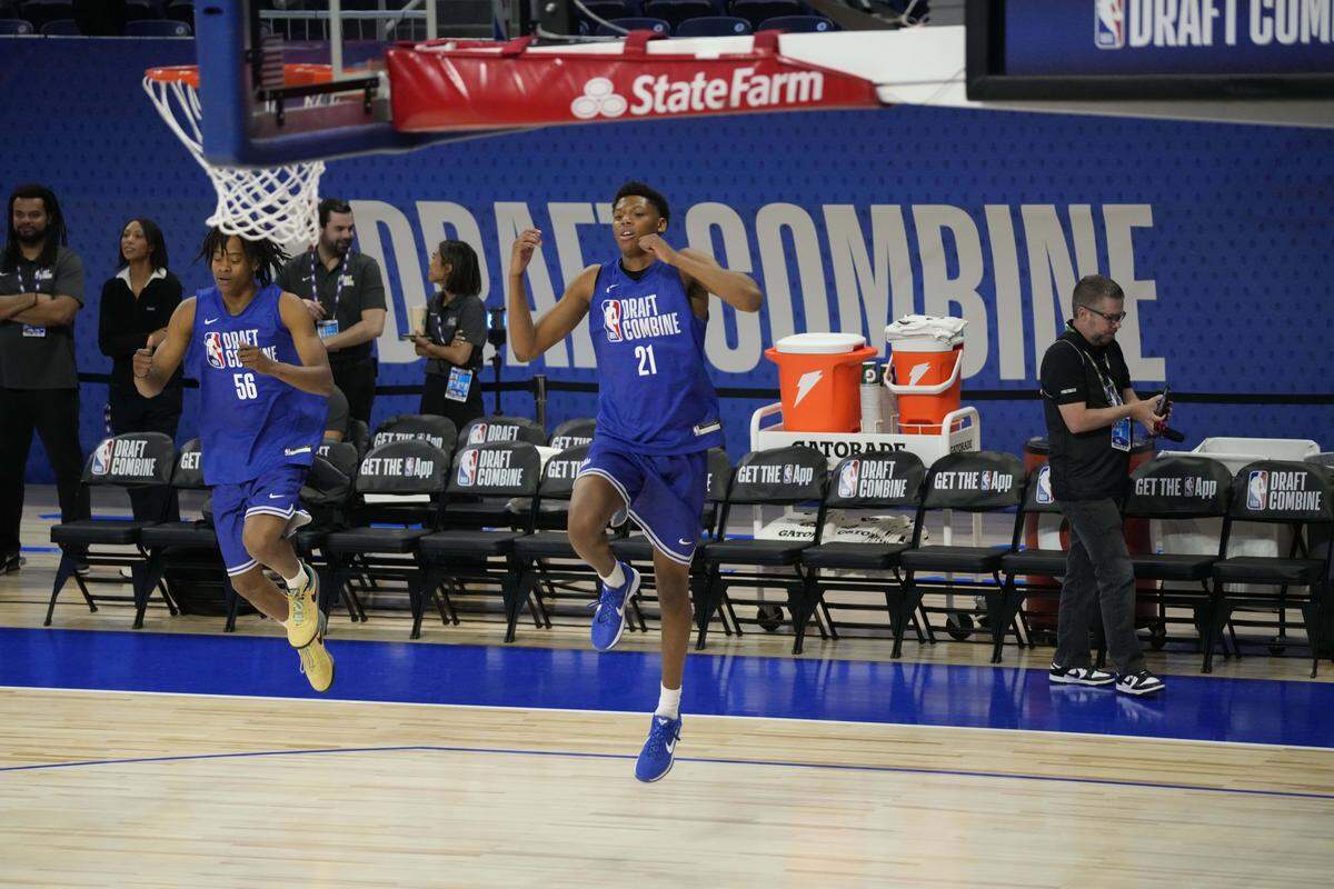 Ace Bailey (21) and Tre Johnson (56) participate in the 2025 NBA Draft Combine at Wintrust Arena. 