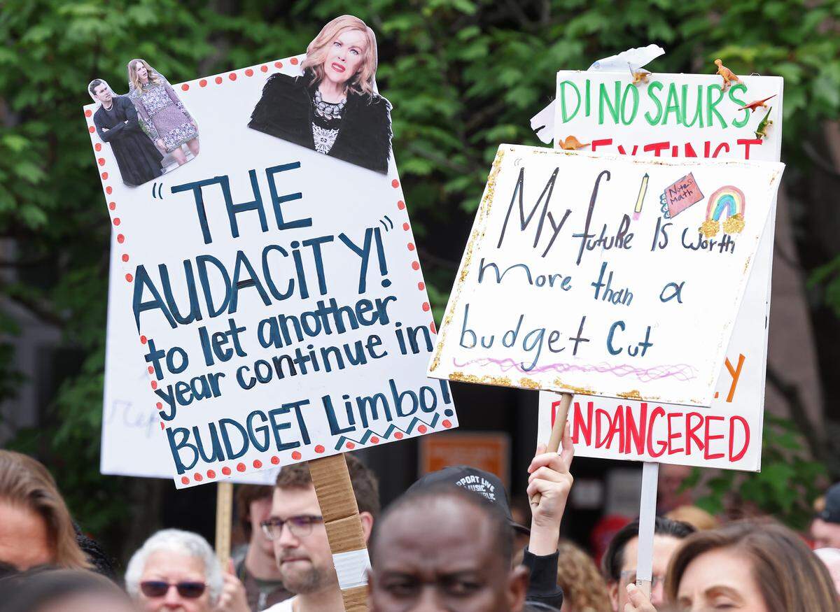Signs, signs, signs were everywhere as teachers rallied at the Government Complex in Raleigh.