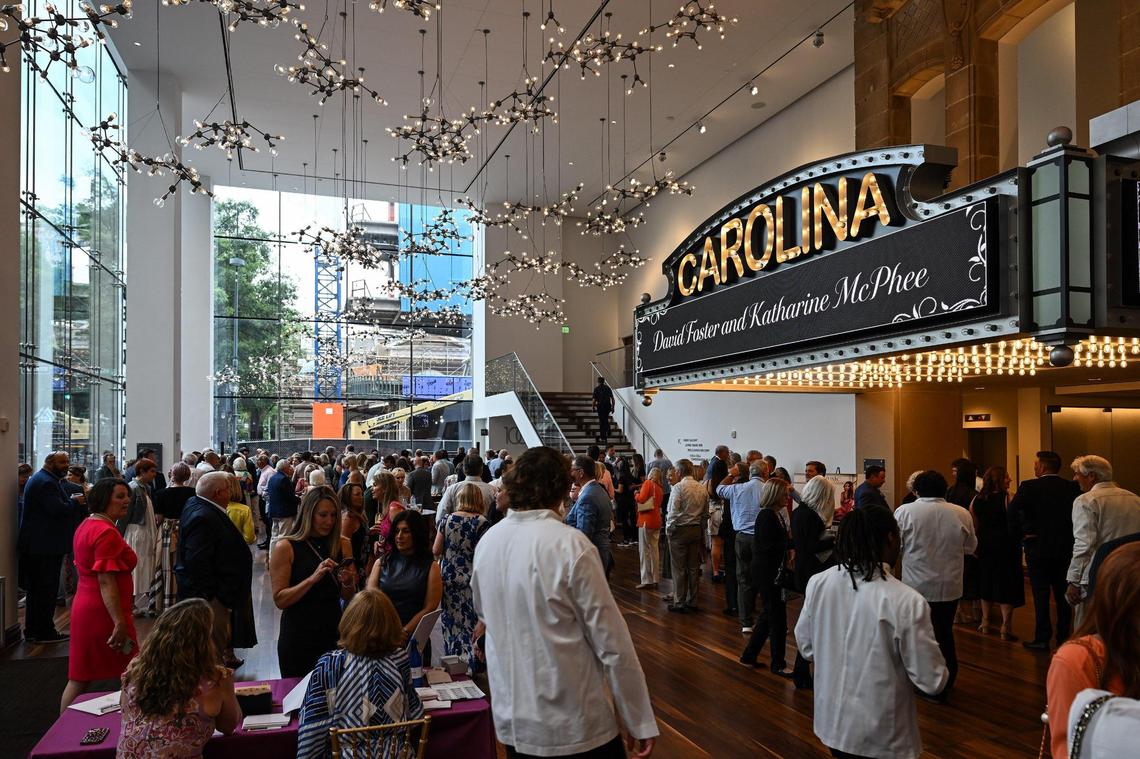 Members of the private Charlotte music club Music With Friends fill the Carolina Theatre lobby before a concert on Tuesday night.