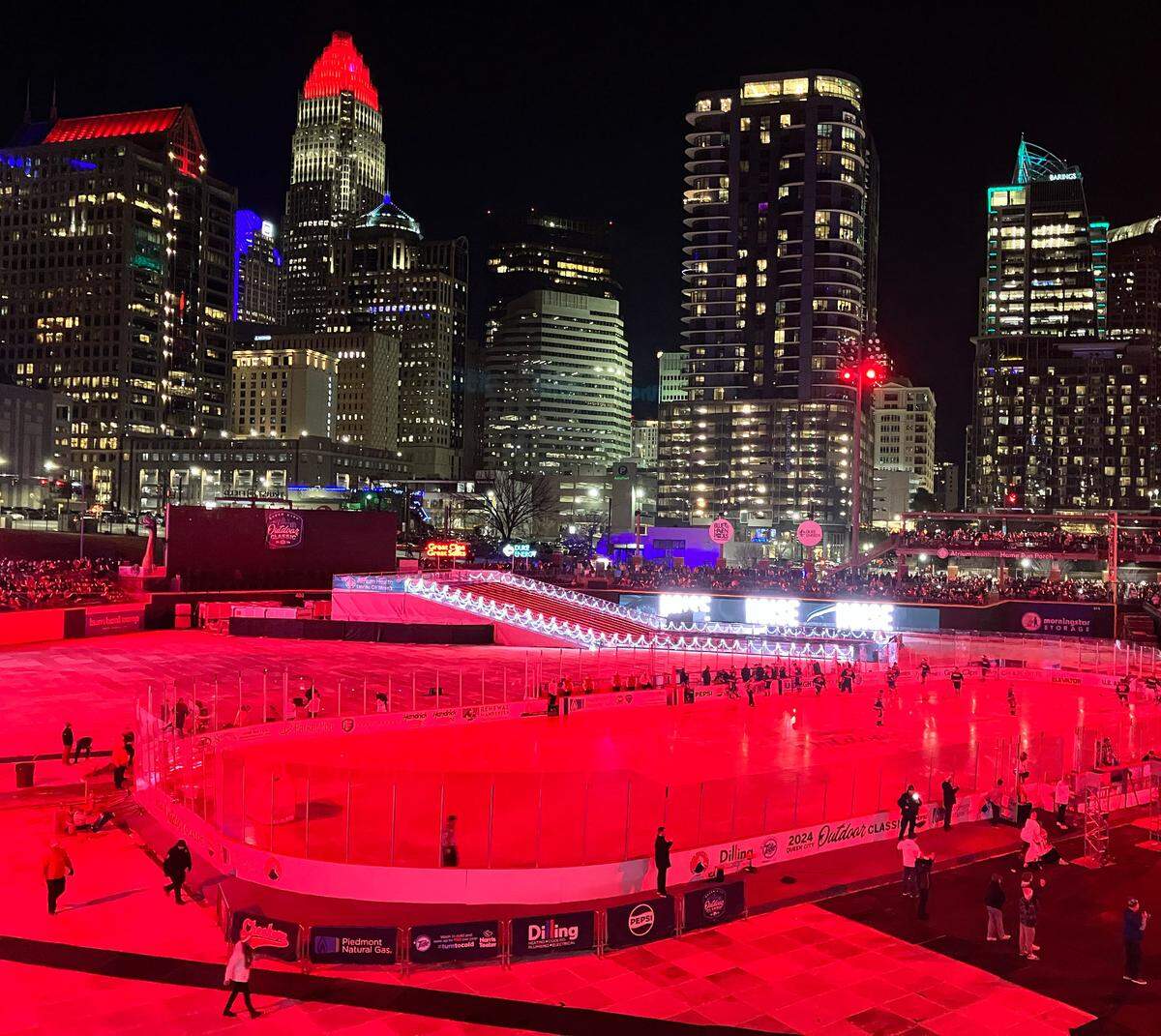 The ice rink at Truist Field was briefly lit up red before the Charlotte Checkers’ game on Saturday, Jan 13, 2024. The Queen City Outdoor Classic was played at the Charlotte Knights home stadium, marking a collaboration between the Checkers and Knights.