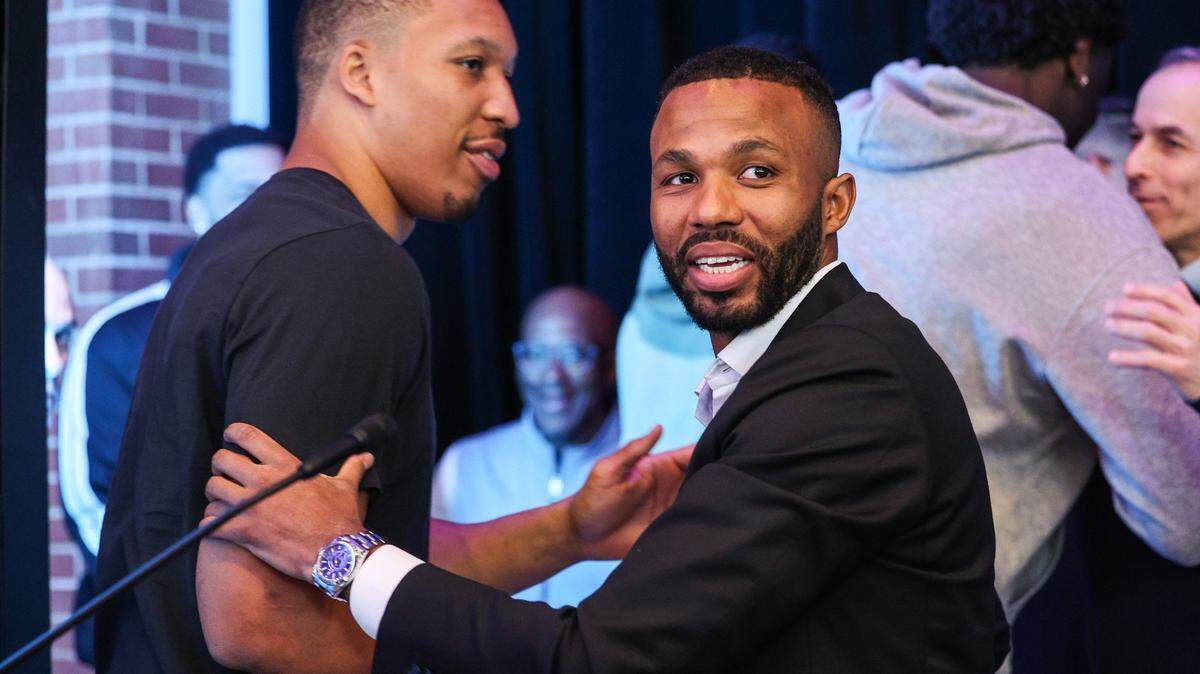 Charlotte Hornets executive vice president of basketball operations Jeff Peterson greets Grant Williams and others after a press conference announcing his role with the organization at Spectrum Center on Wednesday, March 6, 2024. In this role, Peterson becomes the organization’s chief basketball decision-maker while also being responsible for leading the team’s day-to-day basketball operations.