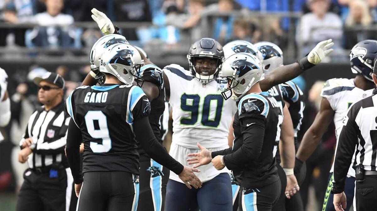 Seattle Seahawks defensive tackle Jarran Reed (90) celebrates Carolina Panthers kicker Graham Gano (9) missing a late-game 52-yard field goal attempt at Bank of America Stadium on Sunday. Seattle won 30-27 on a last-second field goal of its own.