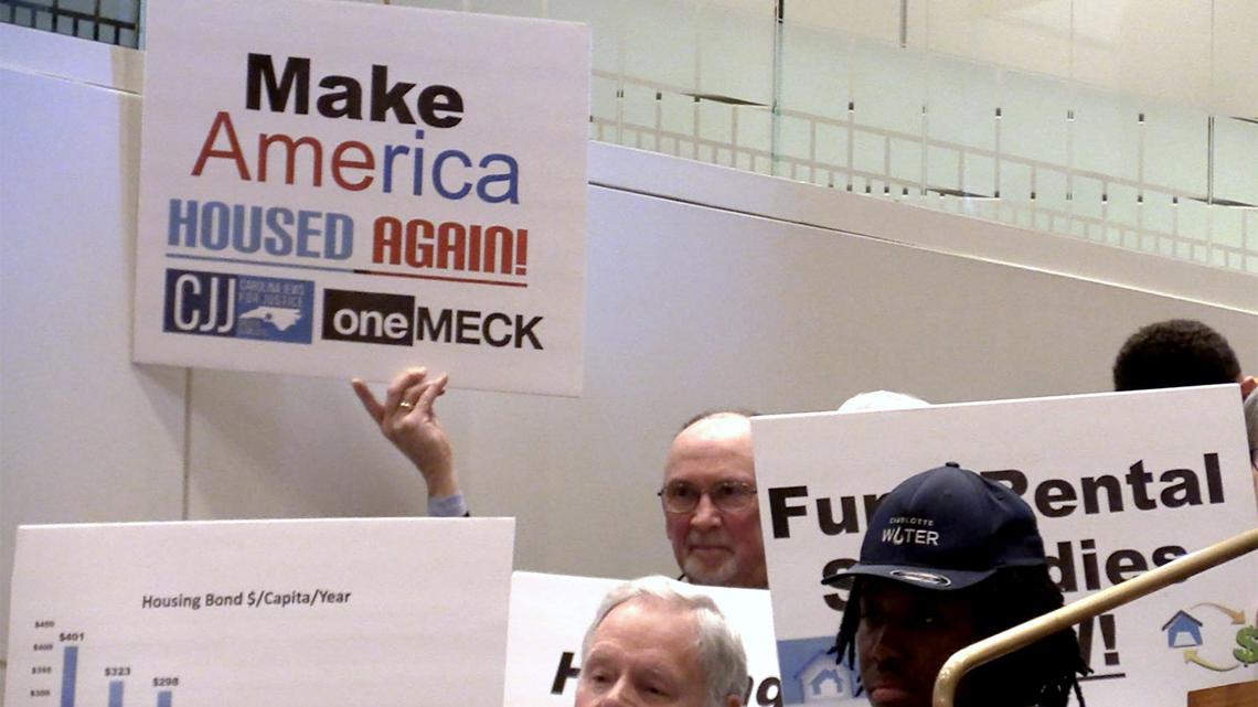 Citizens arrived at the Charlotte City Council meeting on Monday, April 9, 2018 with signs referencing affordable housing.