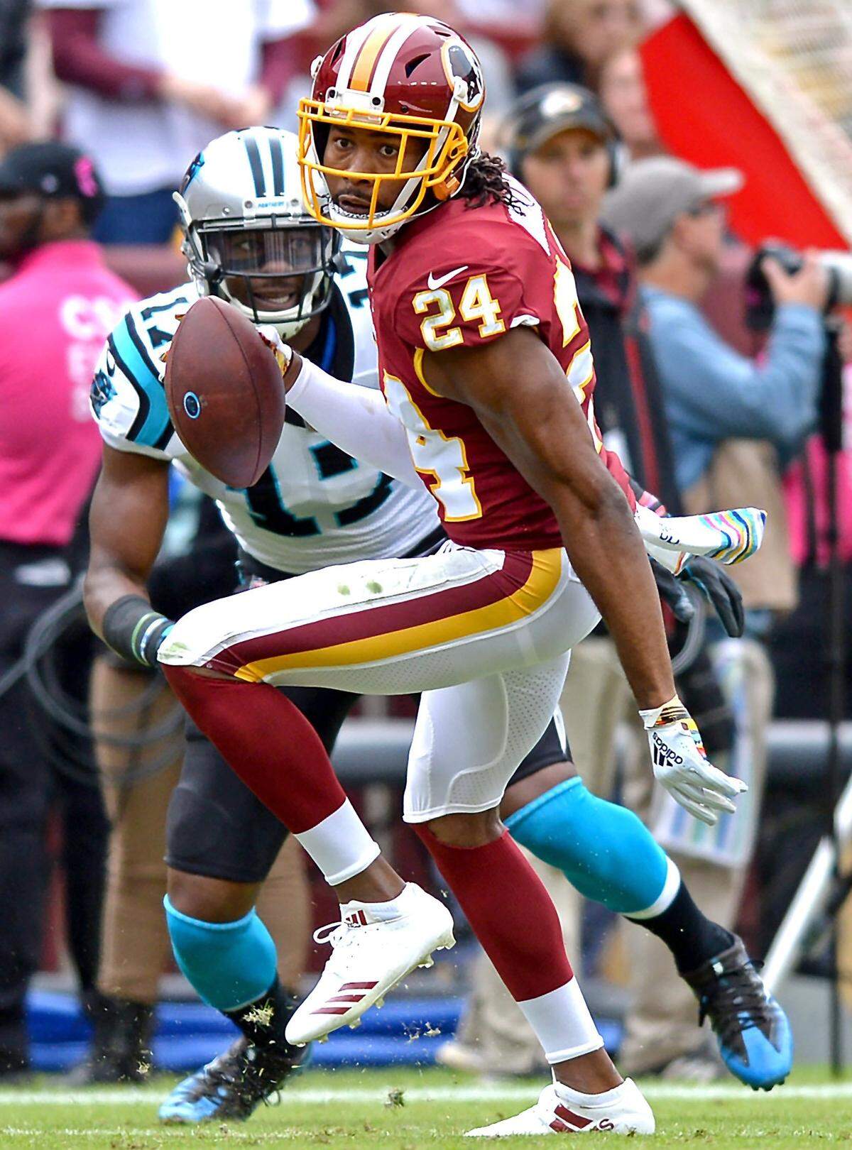Washington Redskins cornerback Josh Norman intercepts a pass by Carolina Panthers quarterback Cam Newton during first half action at FedEx Field in Landover, Maryland on Sunday, October 14, 2018.