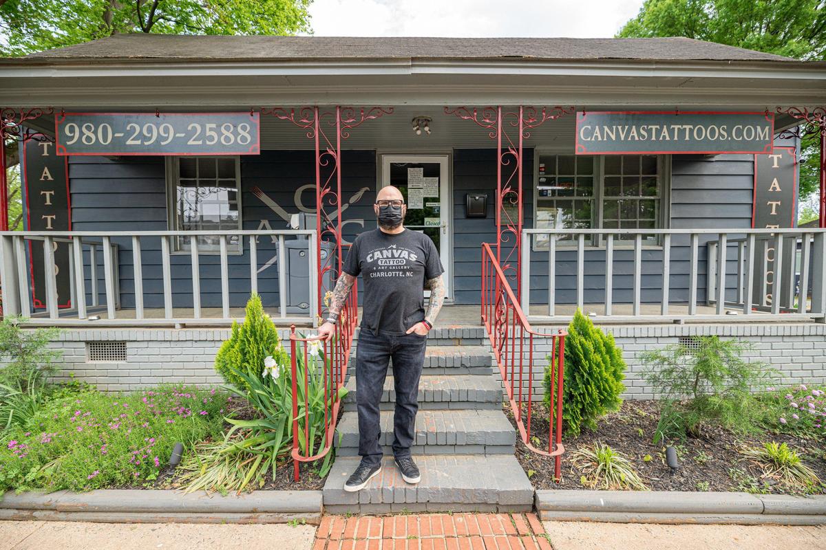 Small business owner Jason Baker added hand sanitizers to all of the entrances of Canvas Tattoo. Since his business is deemed non-essential, Baker must wait until the North Carolina government allows for businesses like his tattoo shop to reopen.