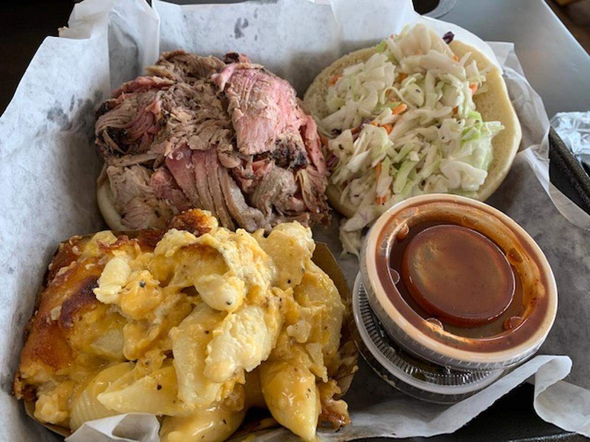 The pork sandwich with slaw and mac and cheese at Jon G’s.