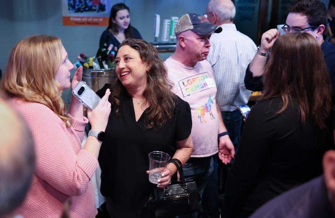 Nicole Sidman, center, chats with supporters at the election watch party at Legion Brewing South Park in CharlotteTuesday night, Nov. 5, 2024