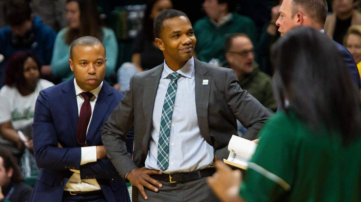 Ron Sanchez, center, will begin his fourth season as Charlotte’s basketball coach Tuesday night when the 49ers host Monmouth.