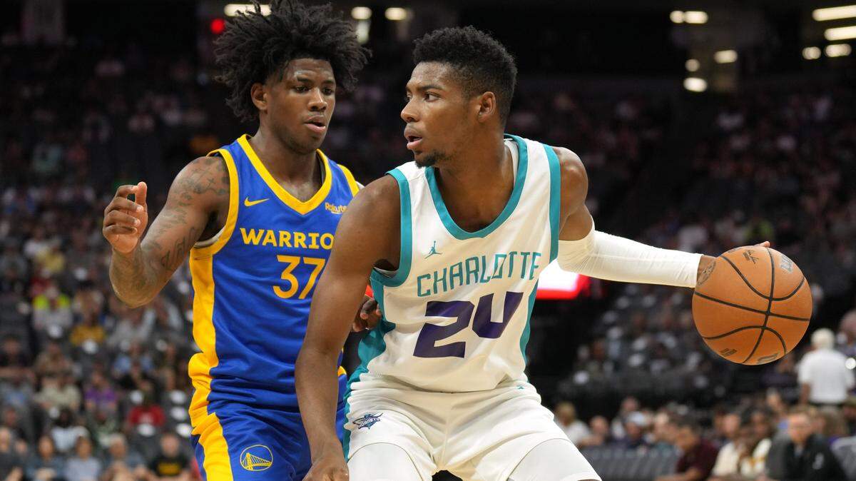 Charlotte Hornets forward Brandon Miller dribbles against Golden State Warriors guard Kendric Davis during a summer league game in Sacramento, California.