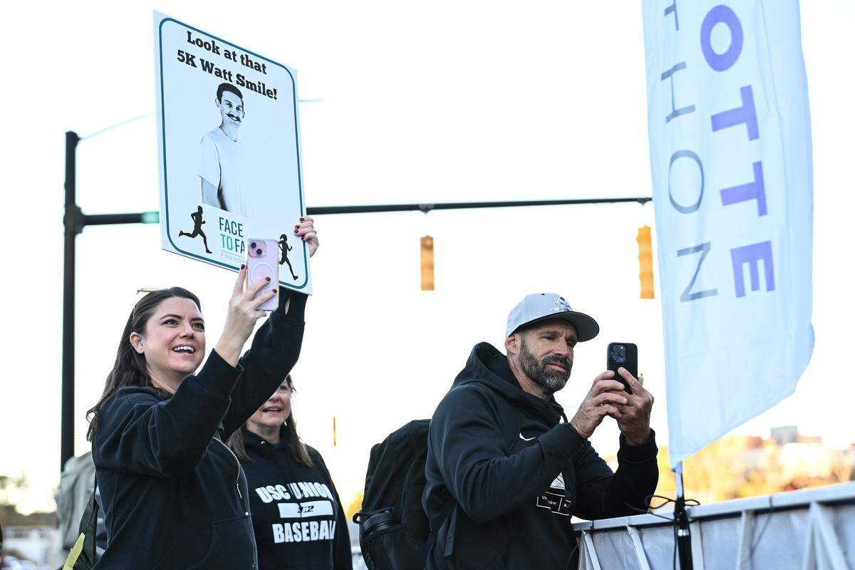 Supporters cheer as participants take part in the 20th annual Novant Health Charlotte Marathon on Saturday, Nov. 16, 2024, in Charlotte