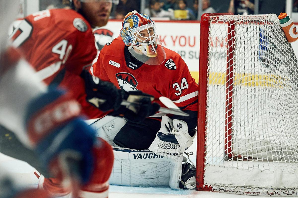 Goaltender Kaapo Kahkonen looks on as a deflected shot lands behind the net in the first period. The Charlotte Checkers face off against the Laval Rockets in Charlotte, NC at the Bojangles Coliseum on June 1, 2025.