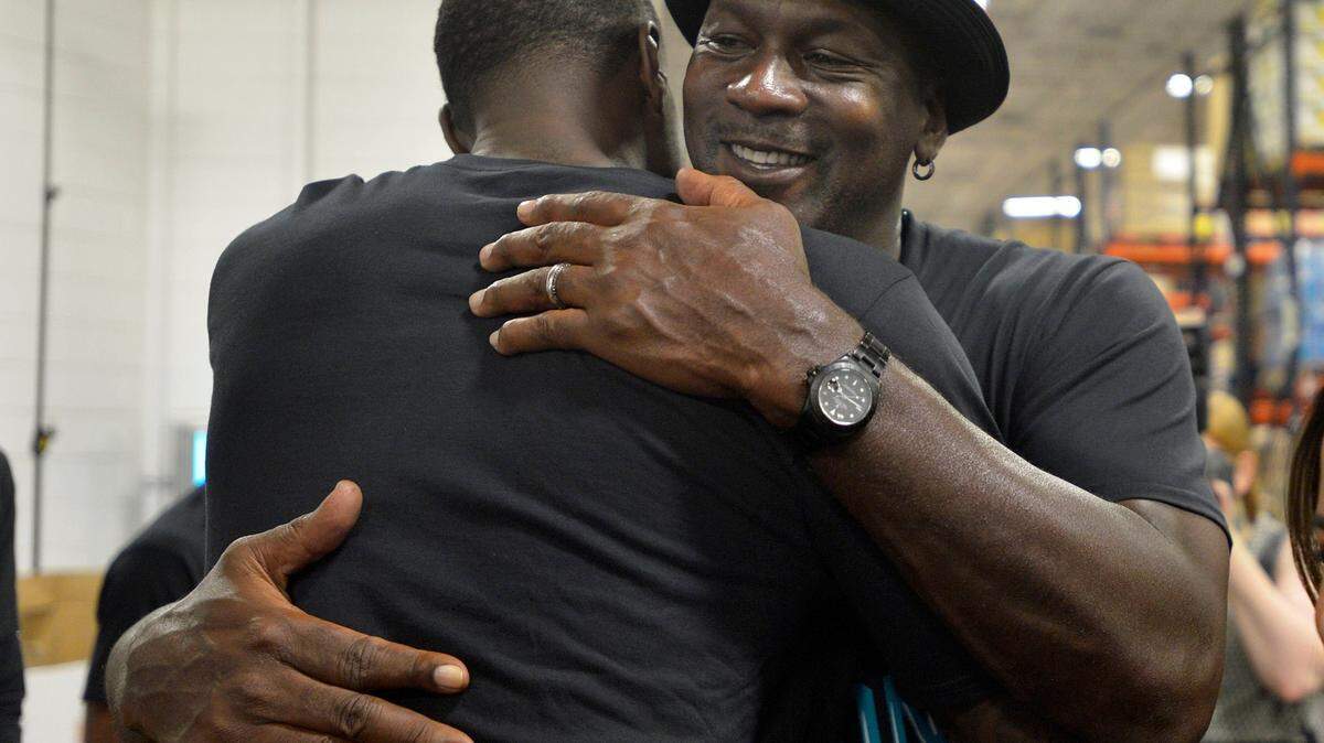 Charlotte Hornets owner Michael Jordan greets people as he made an appearance Friday at Second Harvest Food Bank of Metrolina. The Charlotte Hornets basketball team packed food boxes as part of Hurricane Florence relief efforts.