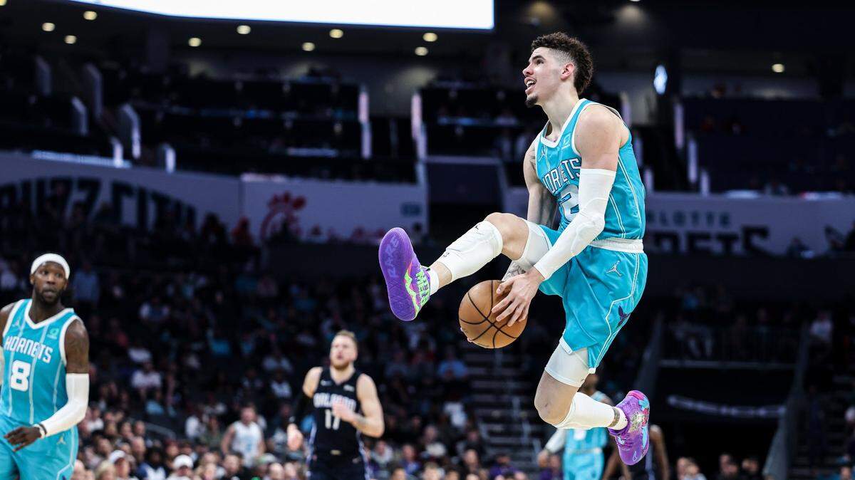 Charlotte Hornets LaMelo Ball passes against Orlando Magic at the Spectrum Center in Charlotte, N.C., on Thursday, April 7, 2022.