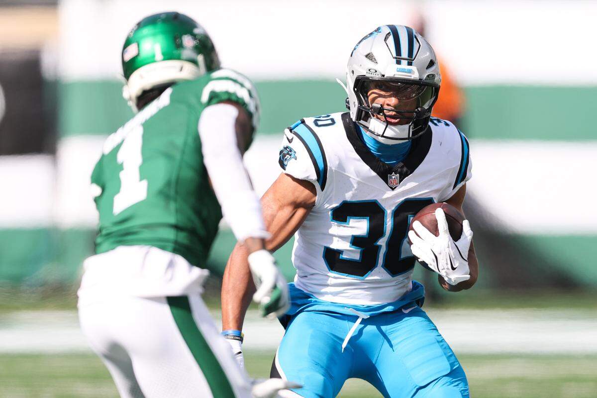 Carolina Panthers running back Chuba Hubbard (30) runs with the ball in the second quarter on Oct. 19, 2025, against the New York Jets at MetLife Stadium.