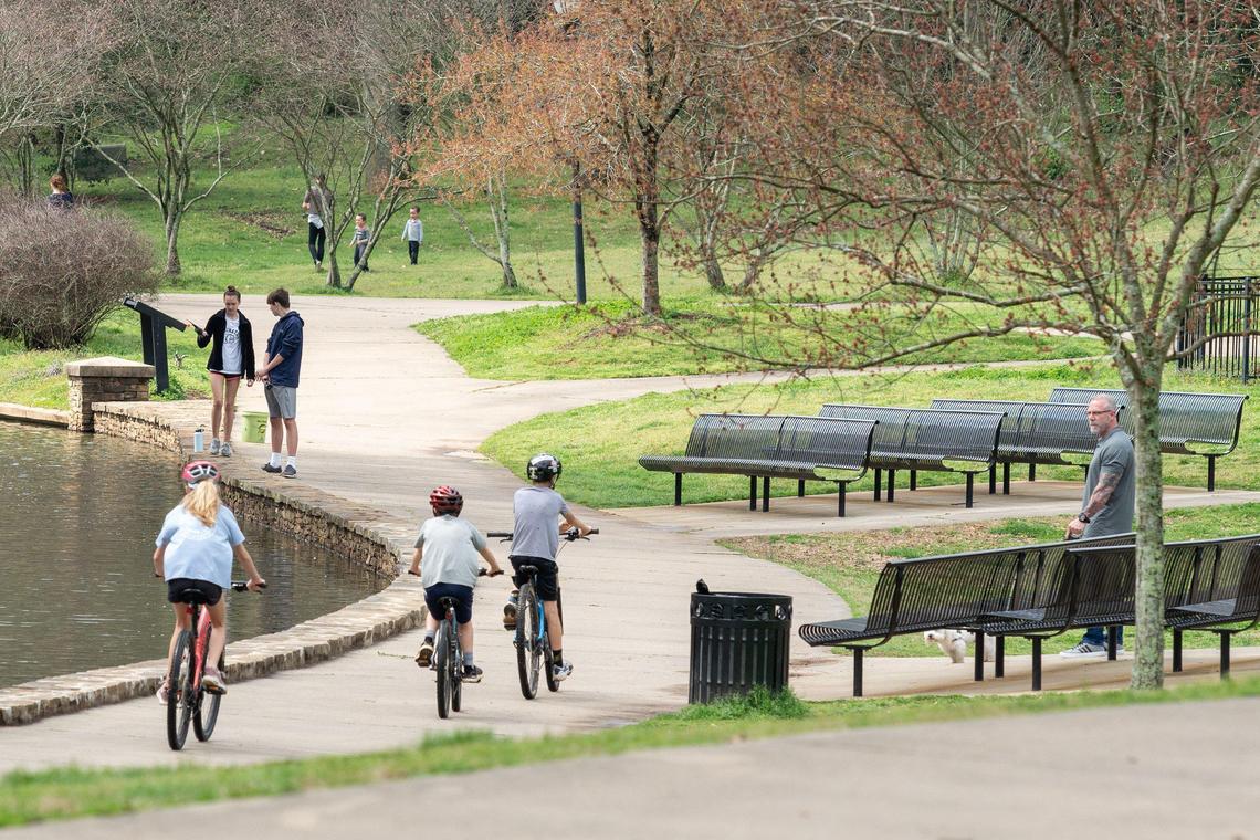 Visitors to Charlotte’s Freedom Park practice a bit of social distancing, generally out in groups of 2-4 people, on Thursday, March 19, 2020.