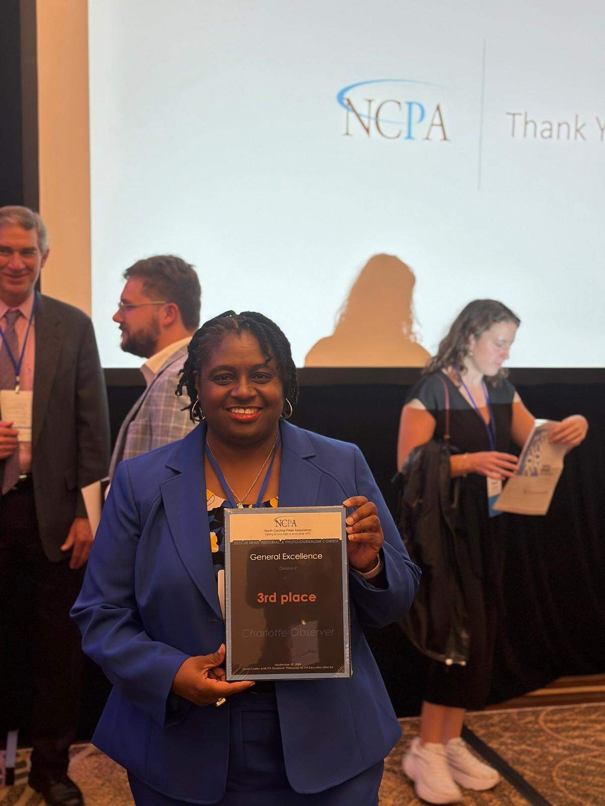 Charlotte Observer Executive Editor Rana Cash holds up award for General Excellence during the North Carolina Press Association Award Banquet, Thursday, Sept. 19, 2024, Sheraton Raleigh Hotel, Raleigh N.C.