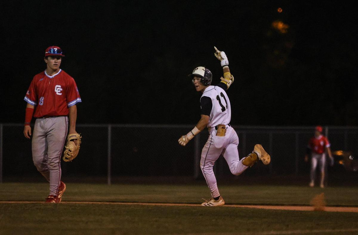 Providence’s Xavier McCoury celebrates a home run as he rounds first base, giving his team a 5-4 victory over Charlotte Catholic in the Southwestern 4A championship baseball game at Garinger High School in Charlotte, NC on Thursday, May 1, 2025.