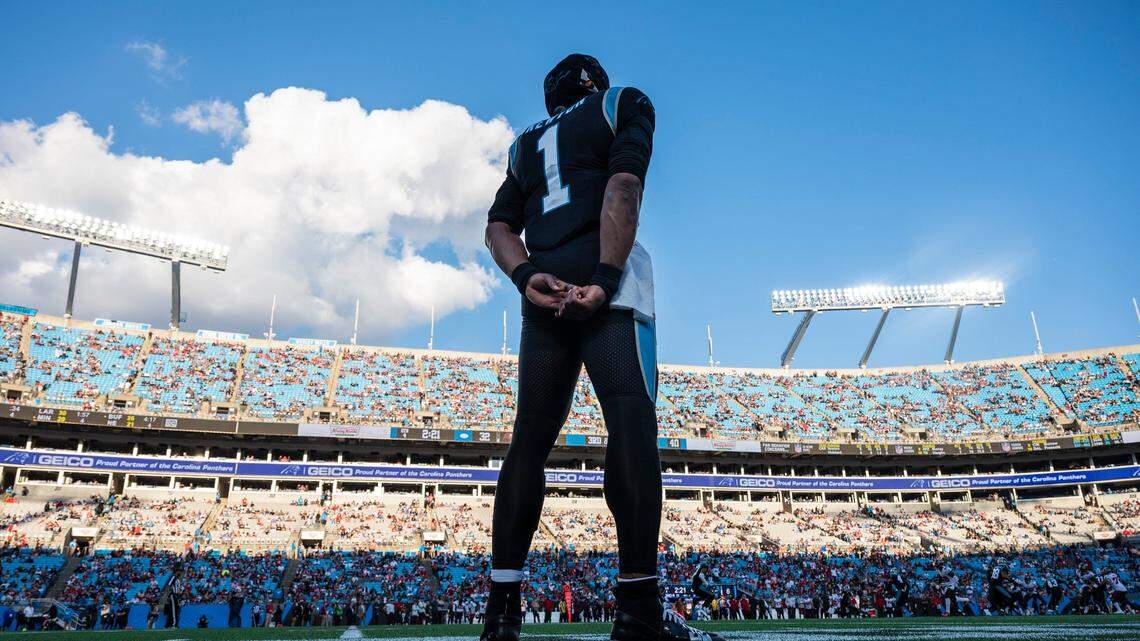 Panthers quarterback Cam newton stands on the sidelines and watches the game against the Buccaneers at Bank of America Stadium on Sunday, December 26, 2021 in Charlotte, NC. Newtons contract end after this season and his future with the Panthers is uncertain.
