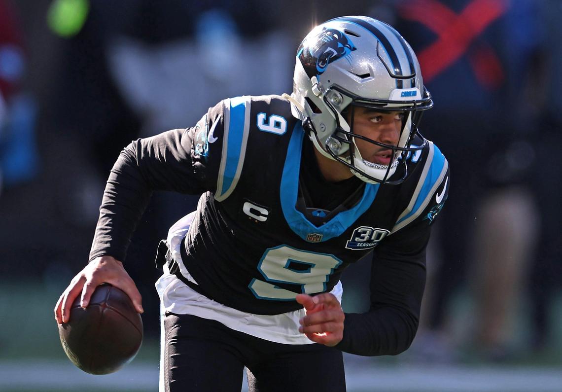 Carolina Panthers quarterback Bryce Young scrambles out of the pocket during action against the Arizona Cardinals at Bank of America Stadium in Charlotte, NC on Sunday, December 22, 2024.