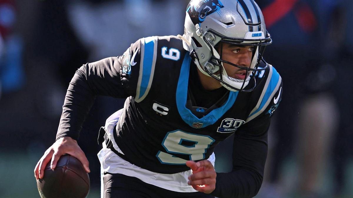 Carolina Panthers quarterback Bryce Young scrambles out of the pocket during action against the Arizona Cardinals at Bank of America Stadium in Charlotte, NC on Sunday, December 22, 2024.