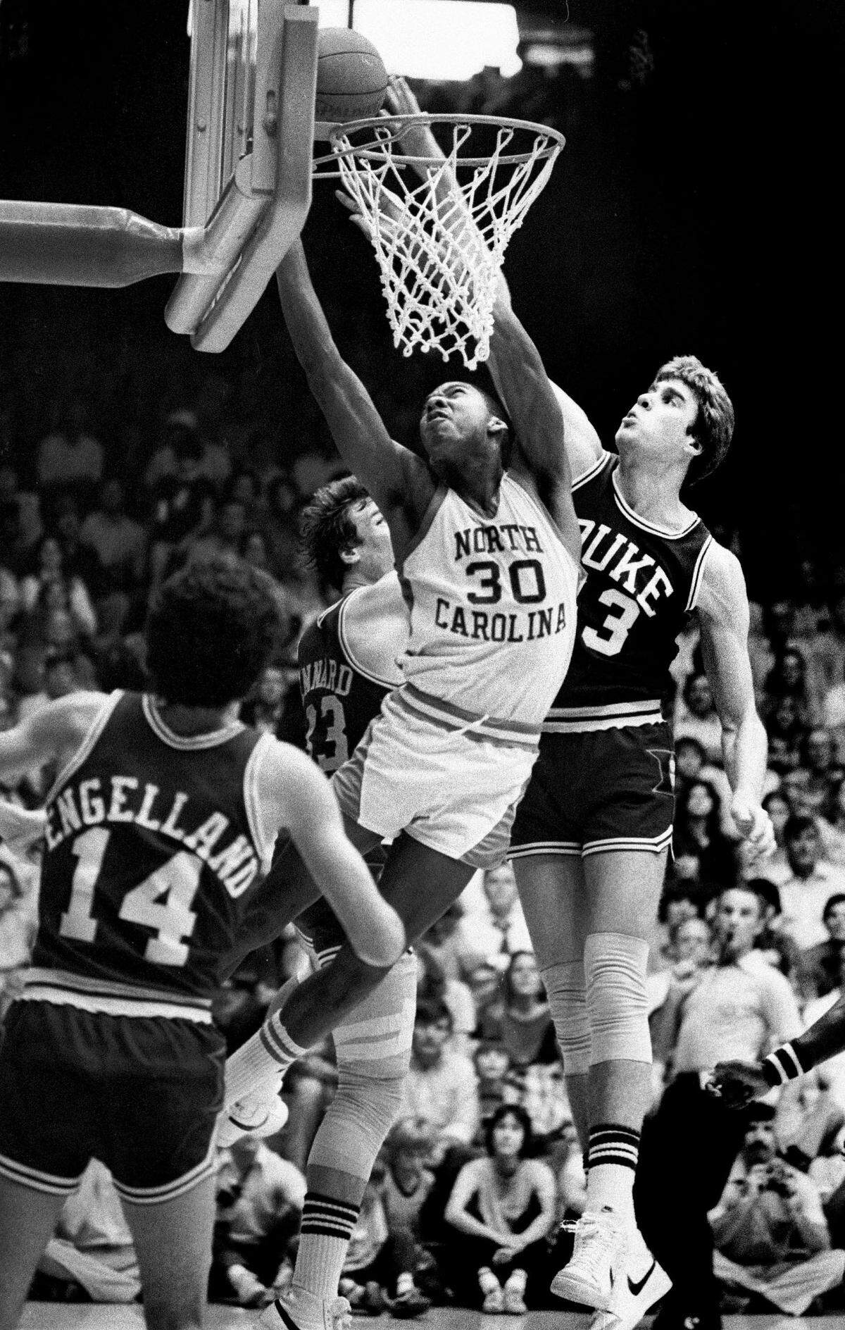 Duke center Mike Gminski blocks an attempted shot by UNC’s Al Wood during ACC action in 1980. Gminski was the ACC’s player of the year for the 1978-79 season and started on the Duke team that got all the way to the NCAA final in 1978 before losing to Kentucky.