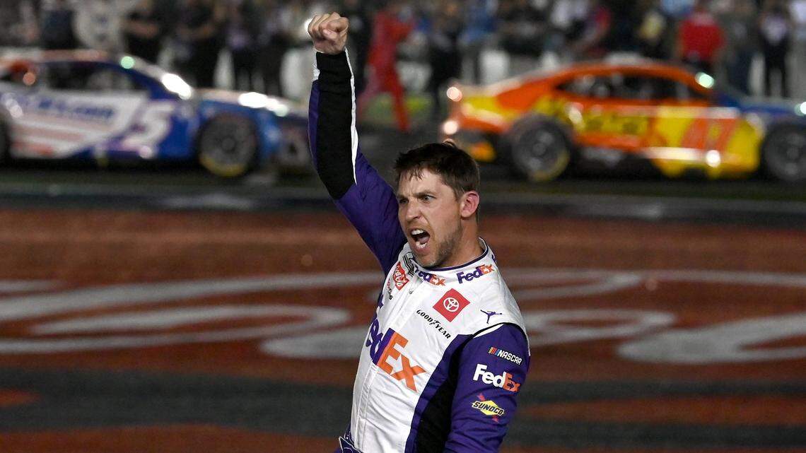 NASCAR driver Denny Hamlin celebrates his victory in the Coca-Cola 600 at Charlotte Motor Speedway on Sunday, May 29, 2022. Hamlin held off Kyle Busch for the victory.