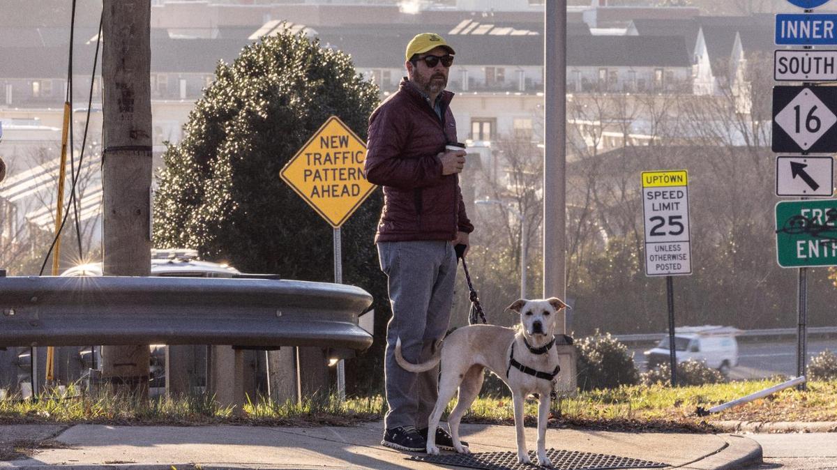 Graham Stevens waits to cross North Davidson Street at 11th street in Charlotte, N.C., on Monday, February 6, 2023.