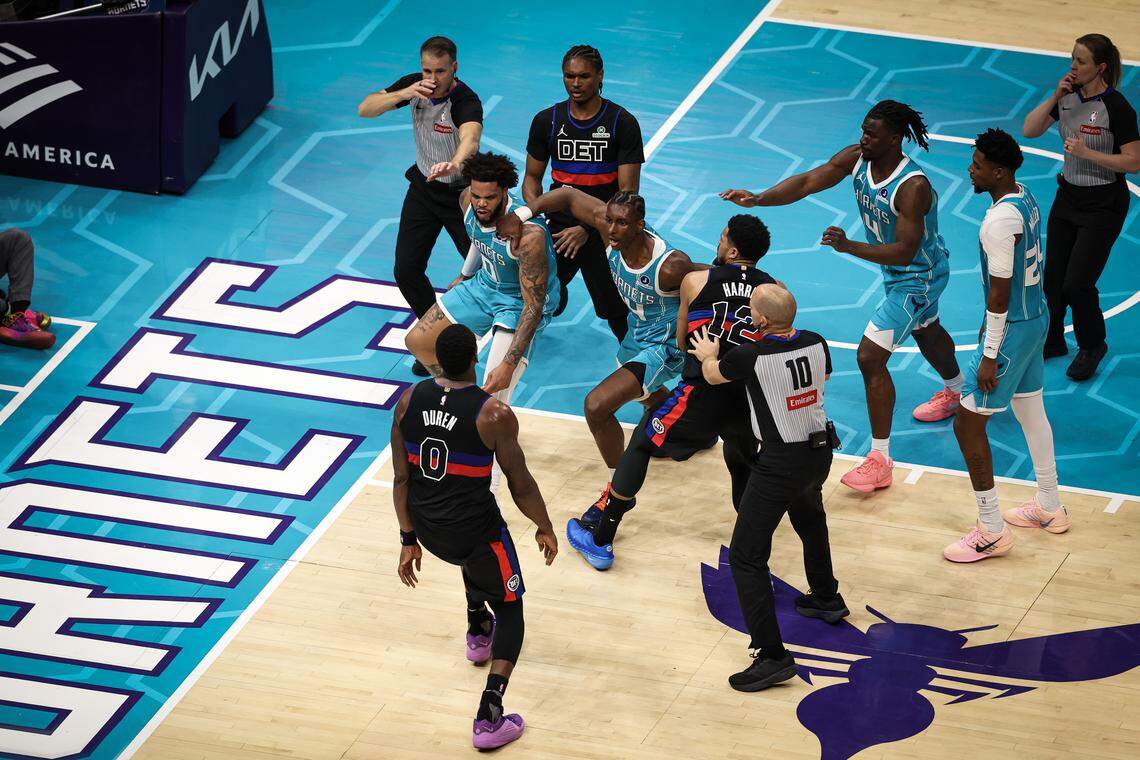 Moussa Diabate (14) and Miles Bridges (0) of the Charlotte Hornets fight Jalen Duren (0) of the Detroit Pistons during the second half at Spectrum Center on Feb. 9, 2026 in Charlotte, North Carolina.