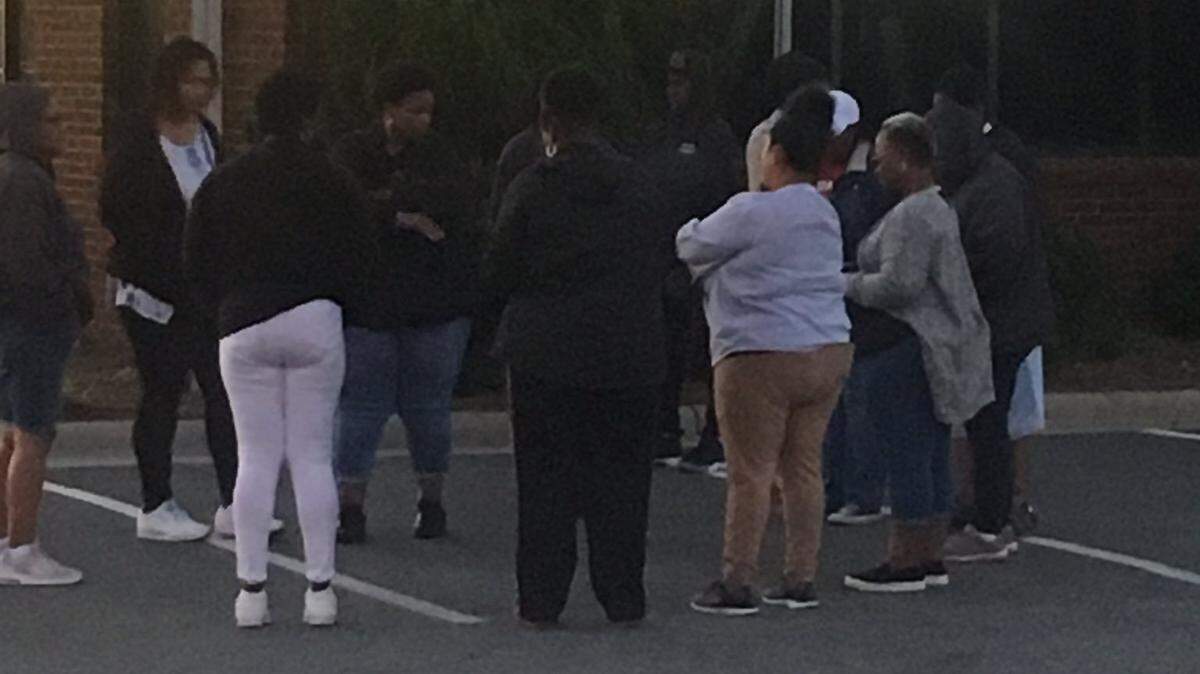 School bus drivers standing outside Union County Schools district offices on Friday morning. 
