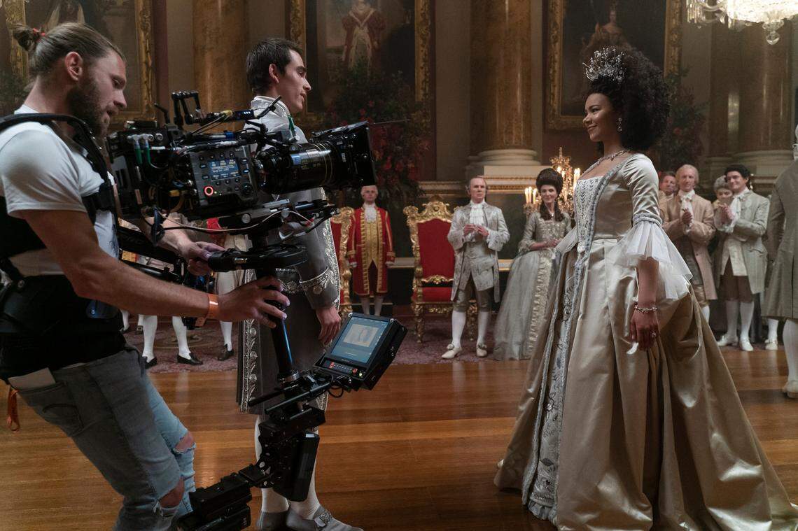 Queen Charlotte: A Bridgerton Story. (L to R) Corey Mylchreest as Young King George, Richard Cunningham as Lord Bute, Michelle Fairley as Princess Augusta, India Amarteifio as Young Queen Charlotte in episode 104 of Queen Charlotte: A Bridgerton Story.