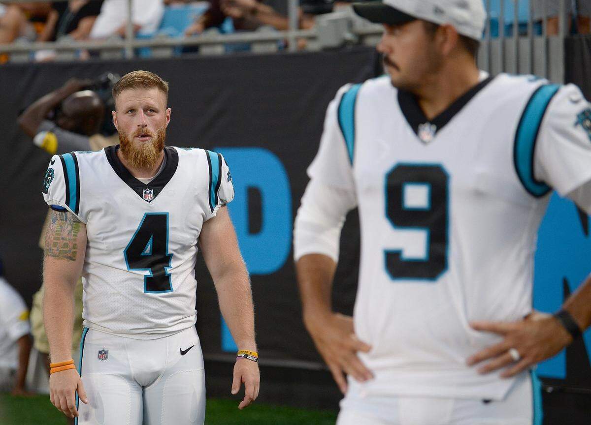 Carolina Panthers kickers Joey Slye, left and Ryan Santoso, right, wait for action to begin in the teamÕs game against the Pittsburgh Steelers at Bank of America Stadium in Charlotte, NC on Friday, August 27, 2021.