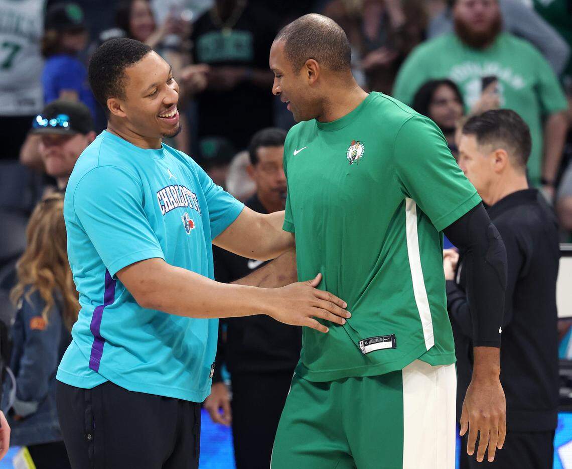 Charlotte Hornets forward Grant Williams, left and Boston Celtics forward/center Al Horford, right, catch up with one another prior to the team’s game at Spectrum Center in Charlotte, NC on Monday, April 1, 2024.