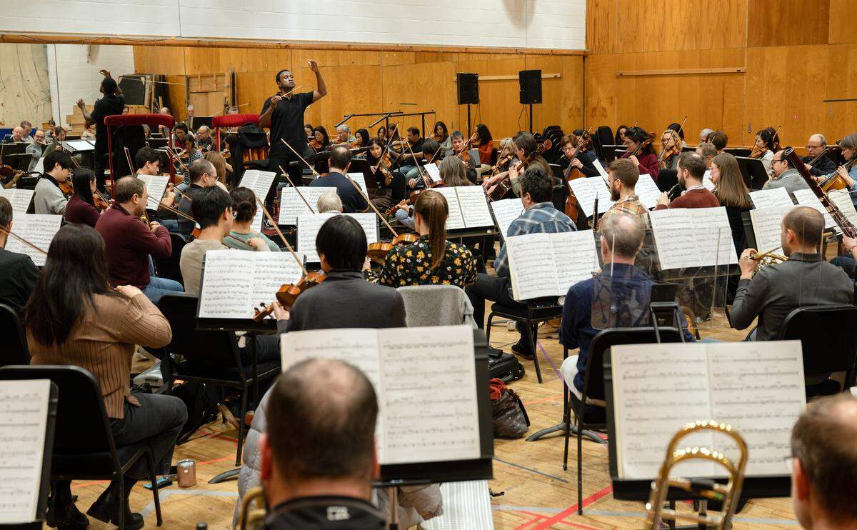 Kwamé Ryan at a Met Opera Orchestra rehearsal for “Porgy and Bess.” “To be part of the ongoing history of this work that has meant so much for Black classical musicians — and then to do it (at the Met Opera House) — is an honor.” 