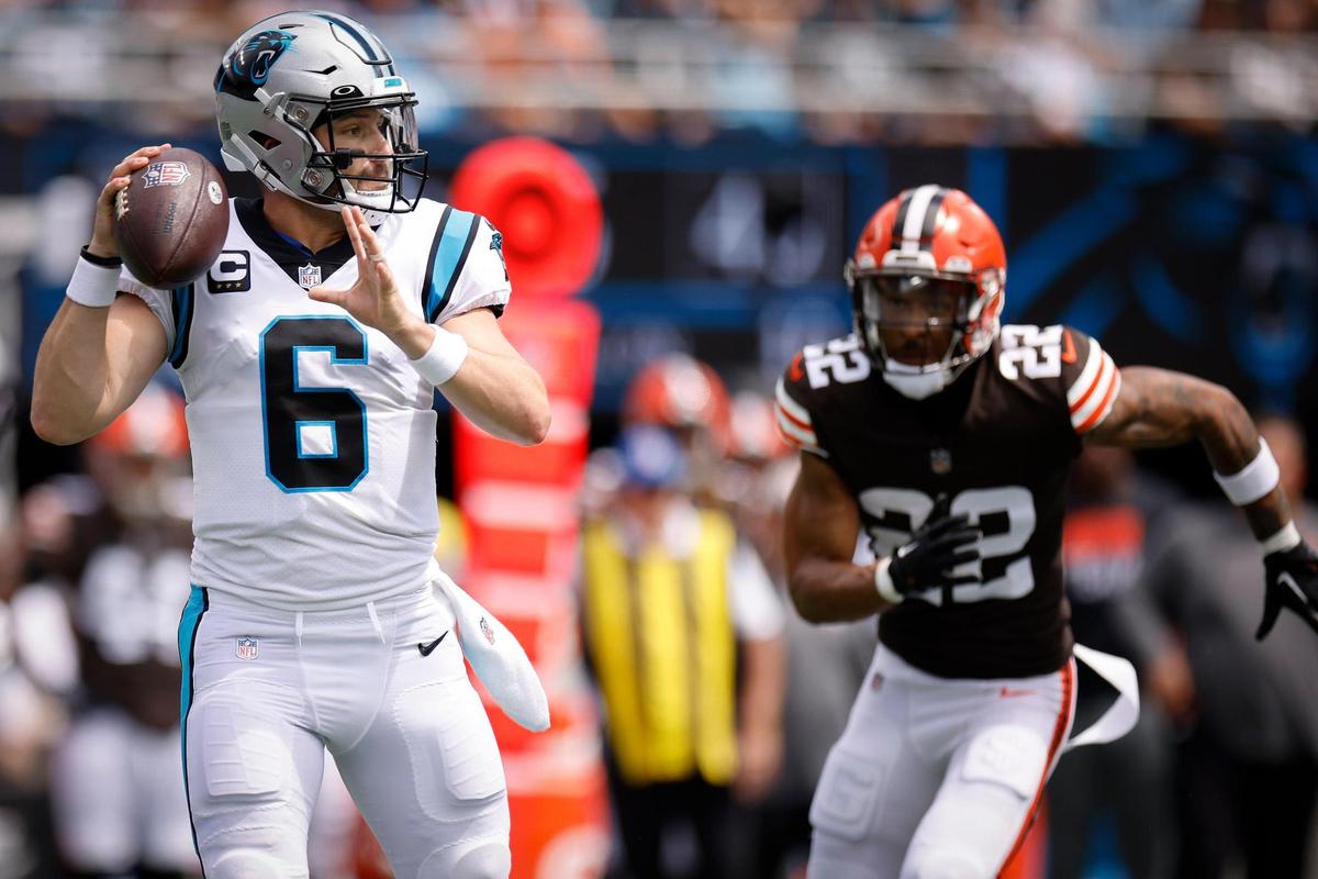 Carolina Panthers quarterback Baker Mayfield (6) passes the ball with pressure from Cleveland Browns safety Grant Delpit (22) during a game at Bank of America Stadium in Charlotte, N.C., Sunday, Sept. 11, 2022.