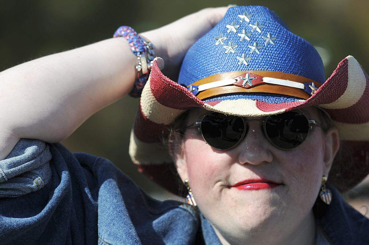 Andrea Williams dons a red, white and blue cowboy hat at the Mallard Creek BBQ Thursday, Oct. 27, 2011 