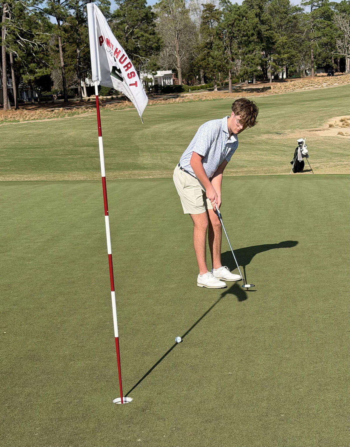 Jake putting for par on 5th green at Pinehurst.