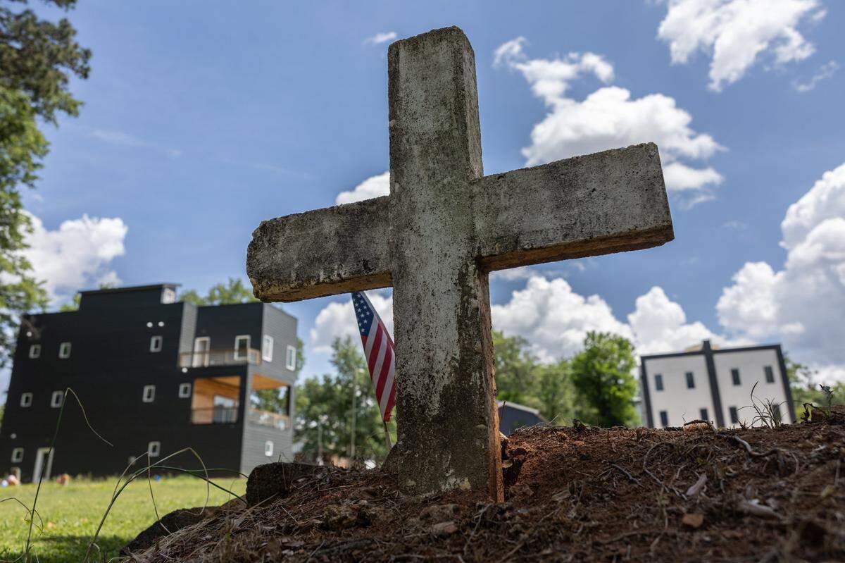 One of the remaining headstones at Biddleville Cemetery in Charlotte is seen on Friday, May 2, 2025. Despite being a historic Black cemetery, located in one of Charlotte’s oldest Black Neighborhoods, it has been forgotten multiple times. Since 1982, good Samaritans have taken it upon themselves to clean and maintain the cemetery.