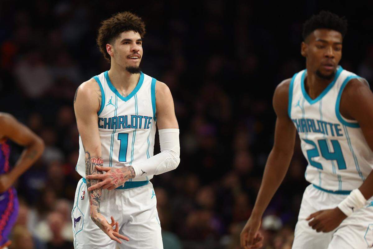 Charlotte Hornets guard LaMelo Ball (1) reacts after a basket against the Phoenix Suns during the first half at Footprint Center.