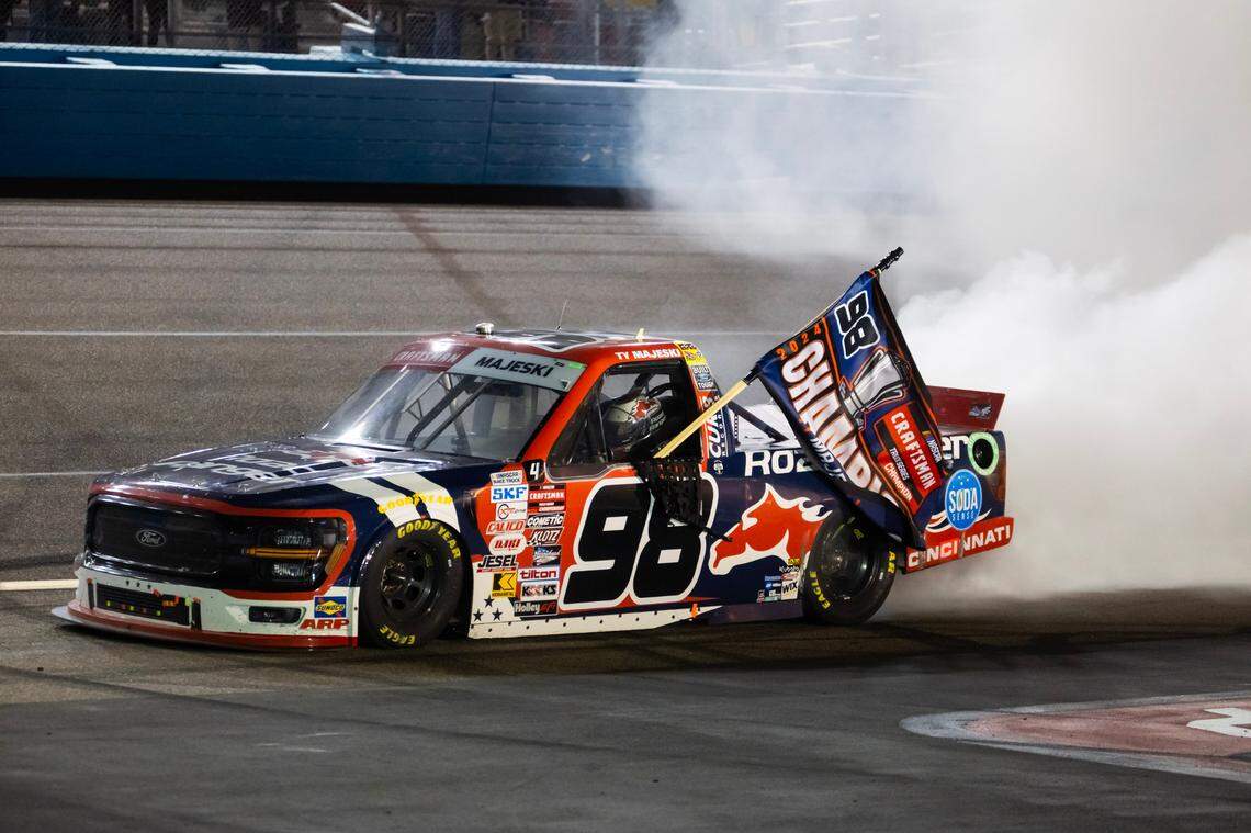 Nov 8, 2024; Avondale, Arizona, USA; NASCAR Truck Series driver Ty Majeski celebrates after winning the 2024 championship and the NASCAR Truck Series championship race at Phoenix Raceway.
