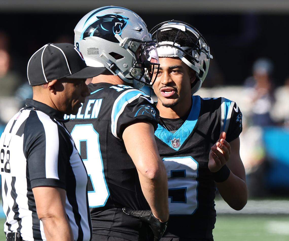 Carolina Panthers quarterback Bryce Young, right, speaks with wide receiver Adam Thielen, left, during a break in second-quarter action at Bank of America Stadium in Charlotte, NC on Sunday, November 19, 2023.