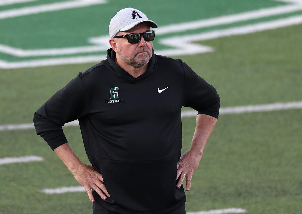 Charlotte 49ers head coach Tim Albin watches his team warmup prior to action against the Rice Owls on Thursday, September 18, 2025 at Jerry Richardson Stadium in Charlotte, NC. Rice defeated Charlotte 28-17.