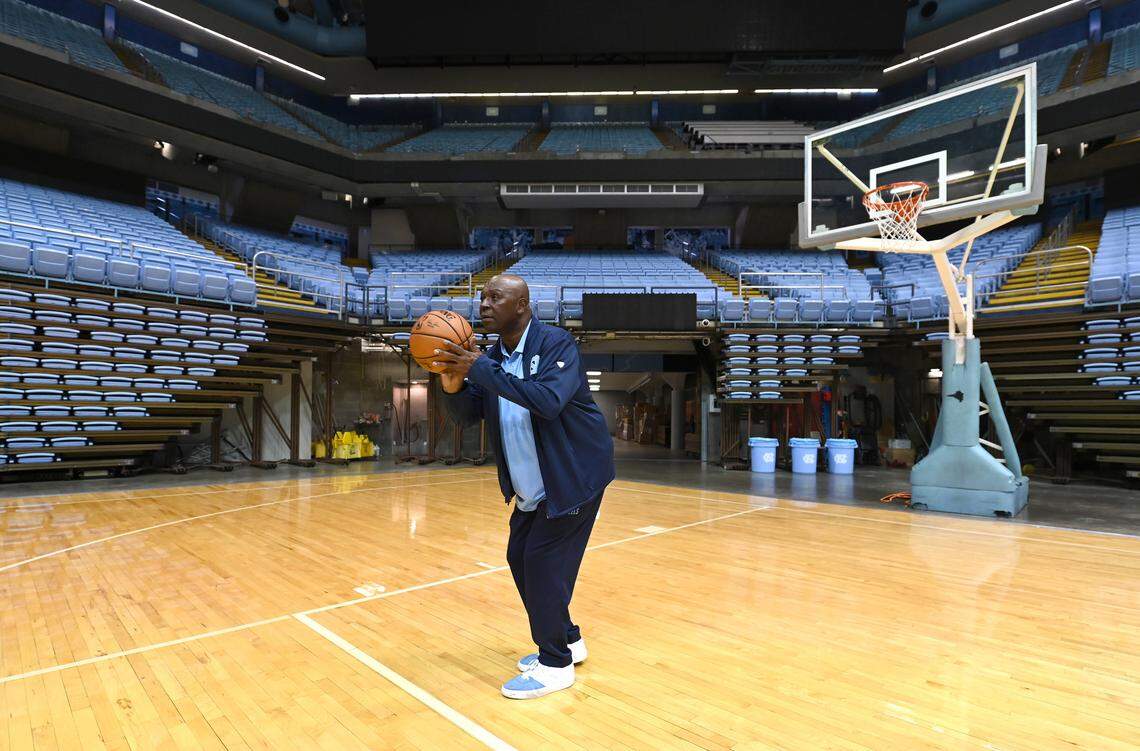 UNC Chapel Hill basketball legend Phil Ford looks to pass to a player working out at the Smith Center in Chapel Hill, NC on Wednesday, June 1, 2022. UNC head coach Dean Smith used the four corners offense under Ford at point guard.