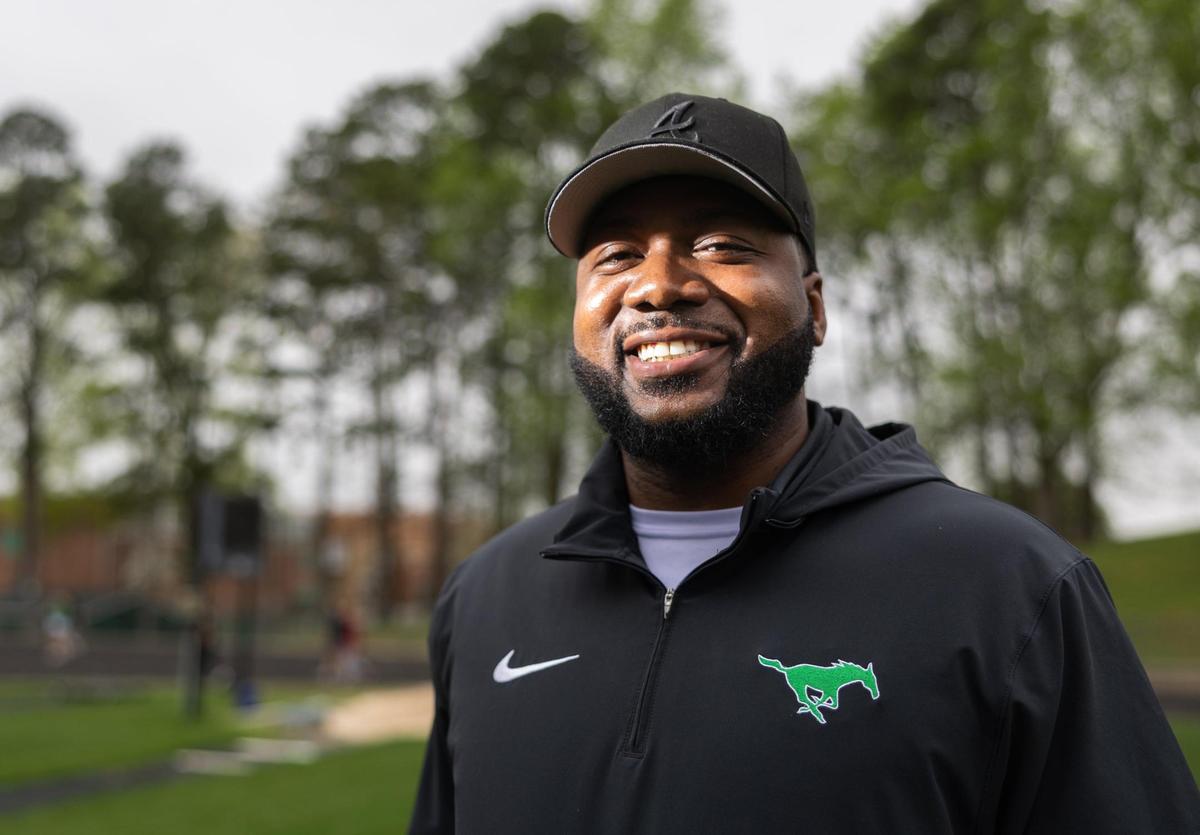 Myers Park football coach Chris James poses for a portrait at Myers Park High School in Charlotte, N.C., on Thursday, April 3, 2025.