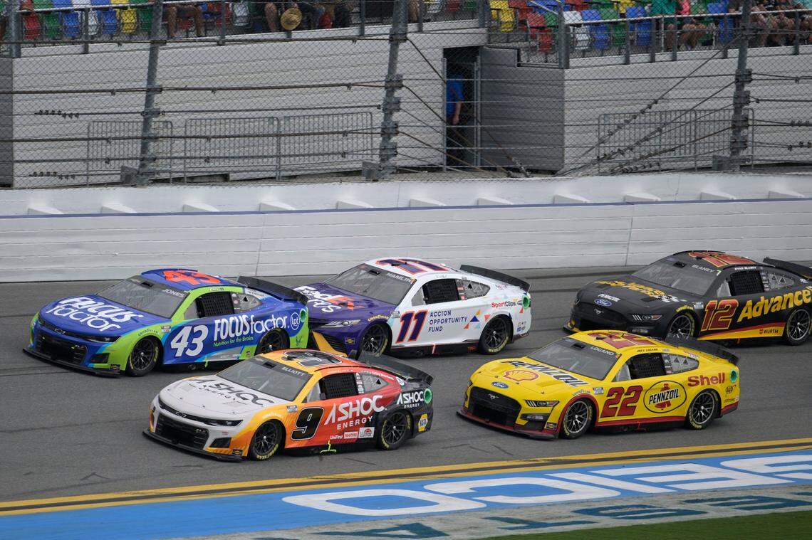 Chase Elliott (9), Erik Jones (43), Denny Hamlin (11), Joey Logano (22) and Ryan Blaney (12) make their way through the front stretch during a NASCAR Cup Series auto race at Daytona International Speedway, Sunday, Aug. 28, 2022, in Daytona Beach, Fla. (AP Photo/Phelan M. Ebenhack)