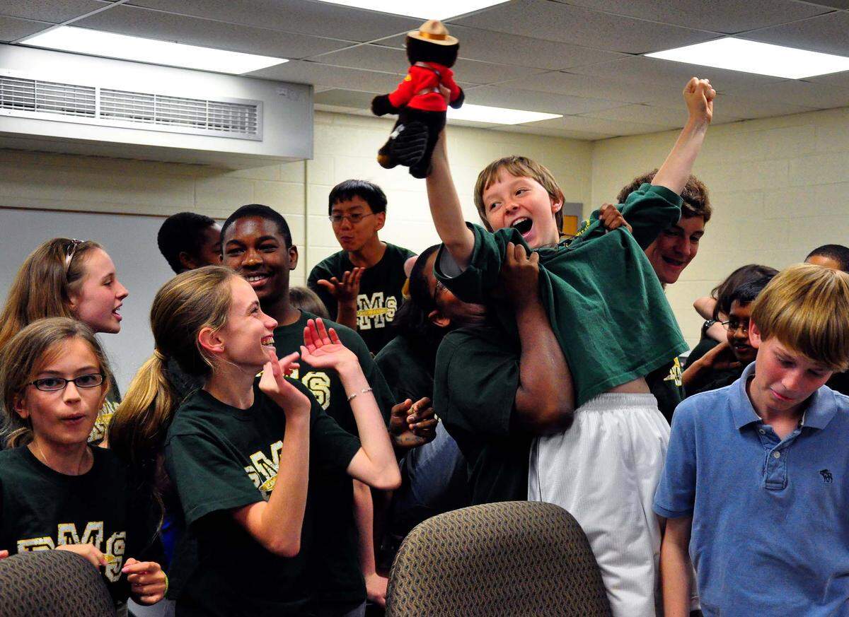 File photo: Pierre Lipton and his Randolph Middle School team celebrate after they won the Academic League Competition semifinals, the academic equivalent of college basketball’s final four.