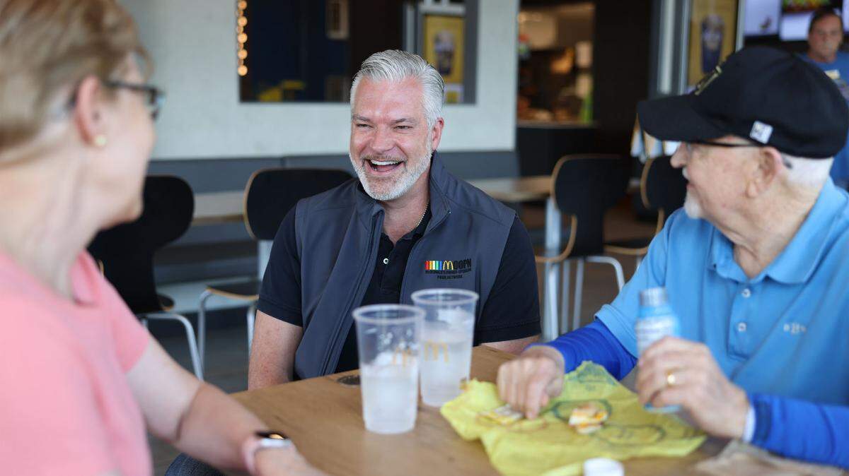 Jason Saylor shares a laugh with customers at his McDonald’s location in Indian Land, S.C., on Tuesday. Saylor owns eight McDonald’s locations in North and South Carolina. McDonald’s will have a booth at the Charlotte Pride festival. Saylor said McDonald’s has been there for him throughout his coming out story and he wants to give back.