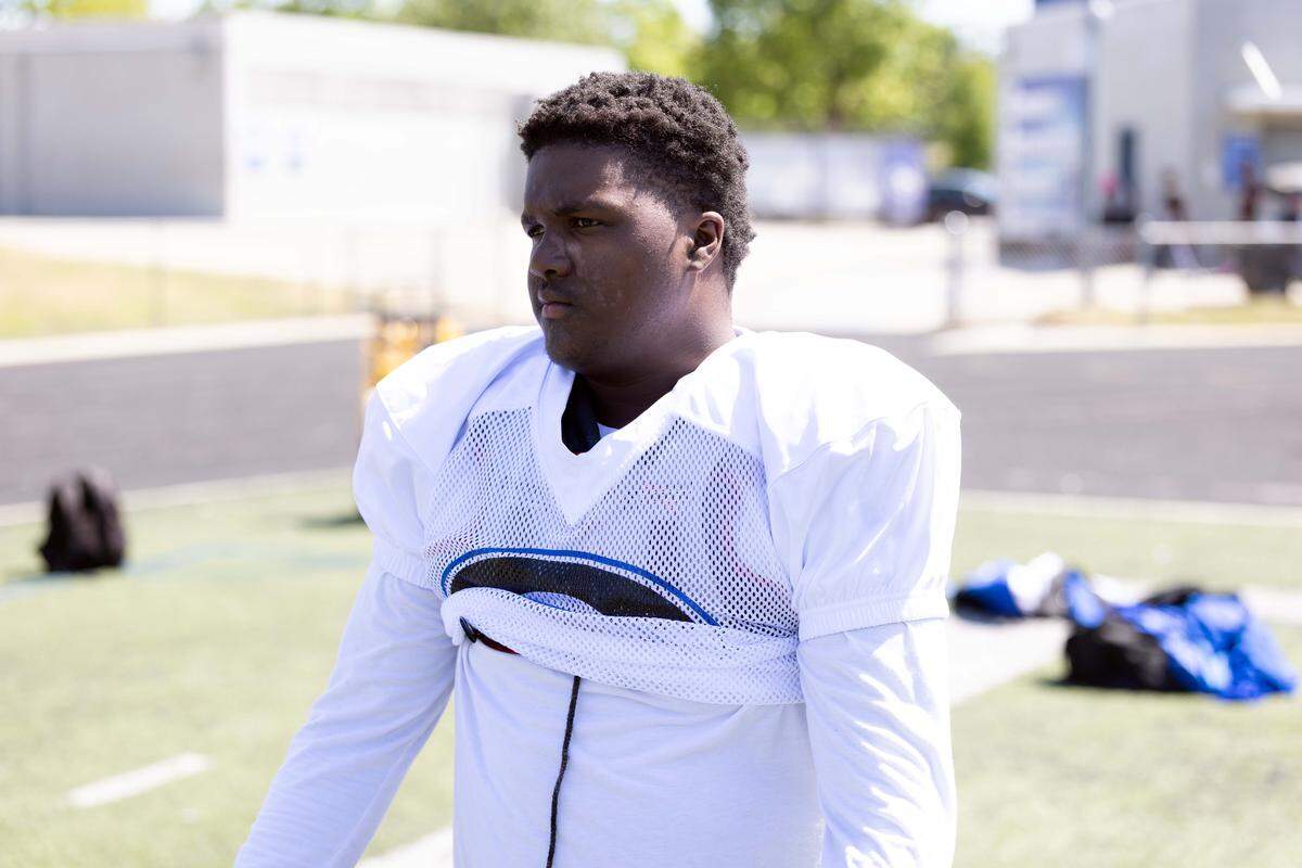 Jacob Andrews prepares for a drill during spring workouts at Garinger High School. Andrews, a junior who remained with the program through multiple coaching transitions, is entering his second season under head coach Jupiter Wilson. 