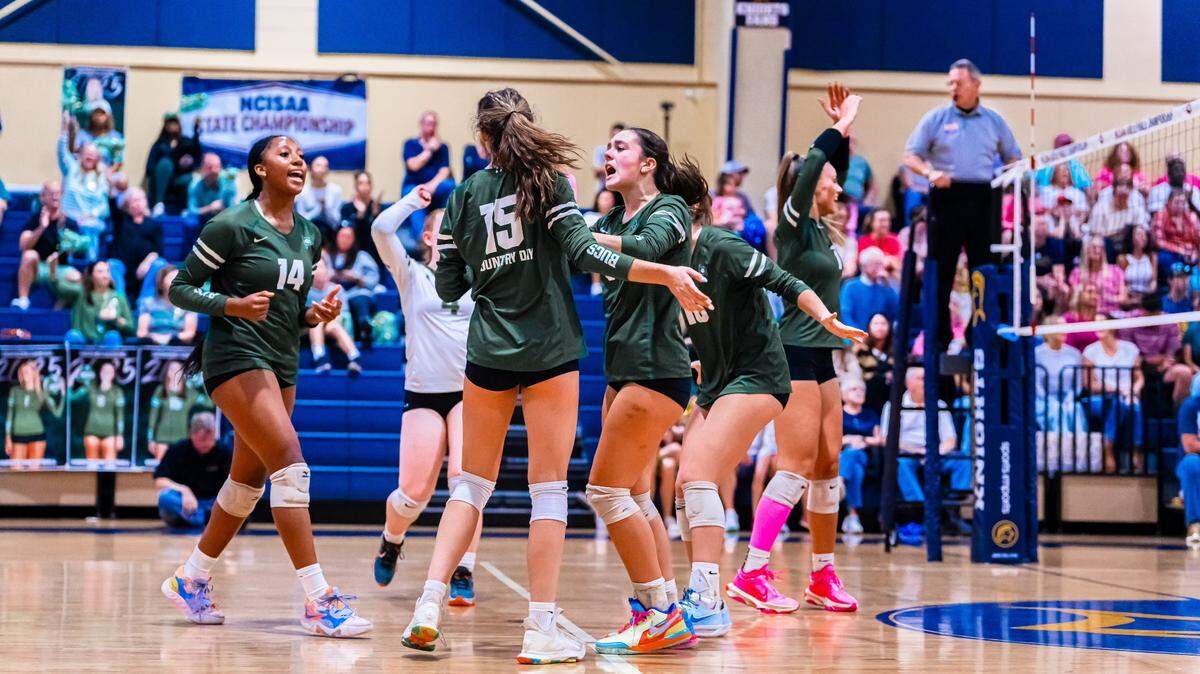 Charlotte Country Day celebrates a point during Saturday’s NCISAA 4A state volleyball final at North Raleigh Christian