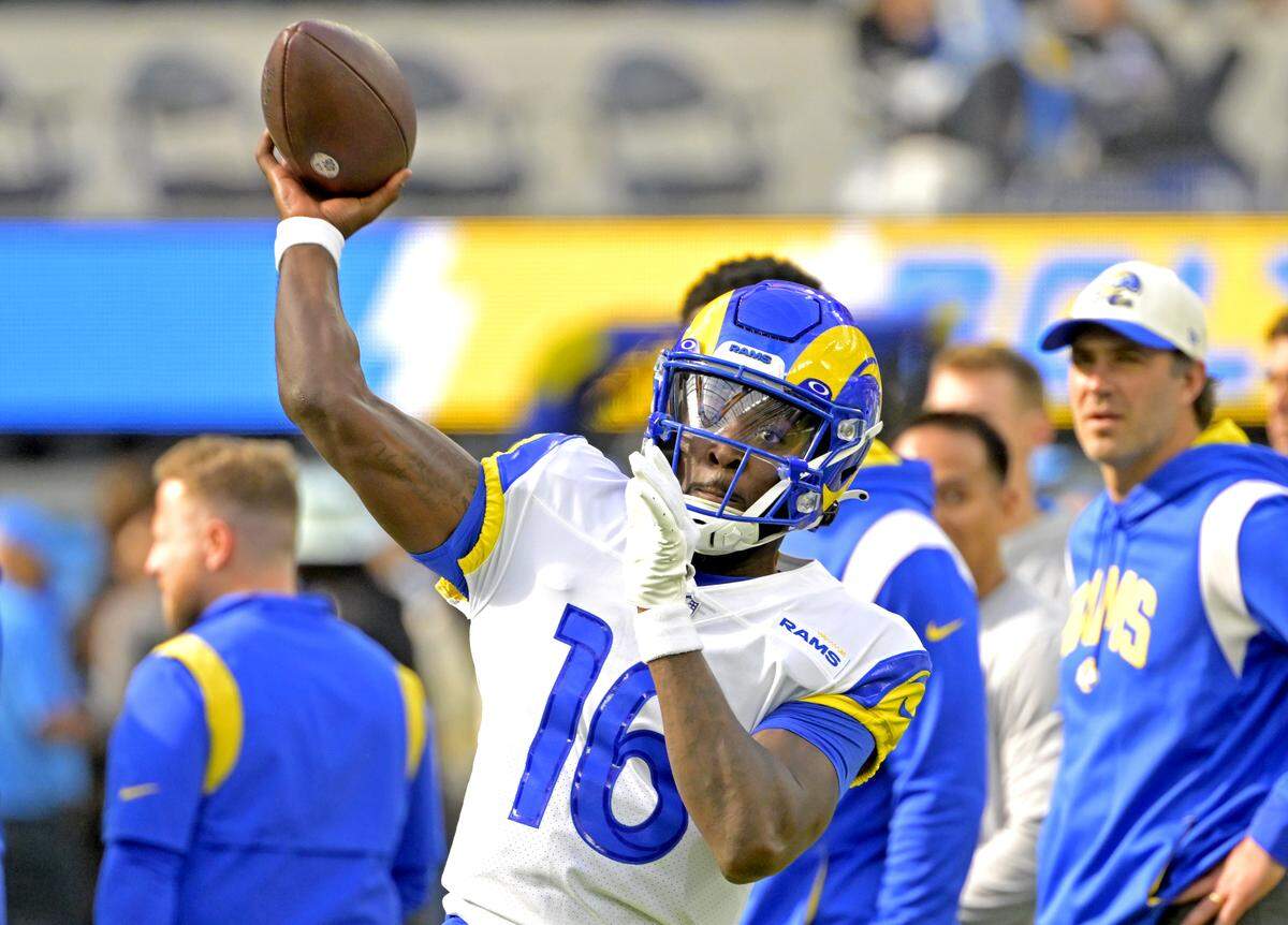Los Angeles Rams quarterback Bryce Perkins (16) warms up prior to a 2023 game against the Los Angeles Chargers at SoFi Stadium. 